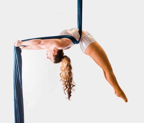 One of our instructors demonstrates an aerial silks move