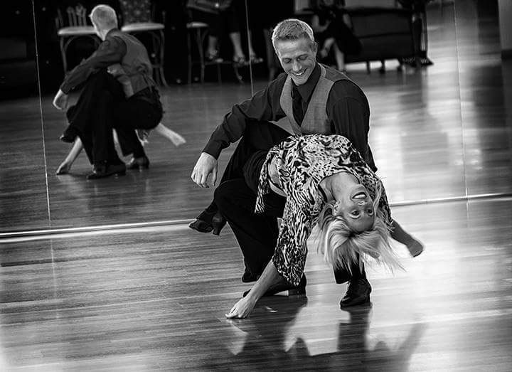 Instructor Terry Lee performing ballroom dance with a partner